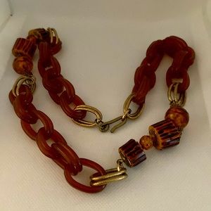 Vintage Bakelite link necklace with bakelite wood log beads. Textured gold links